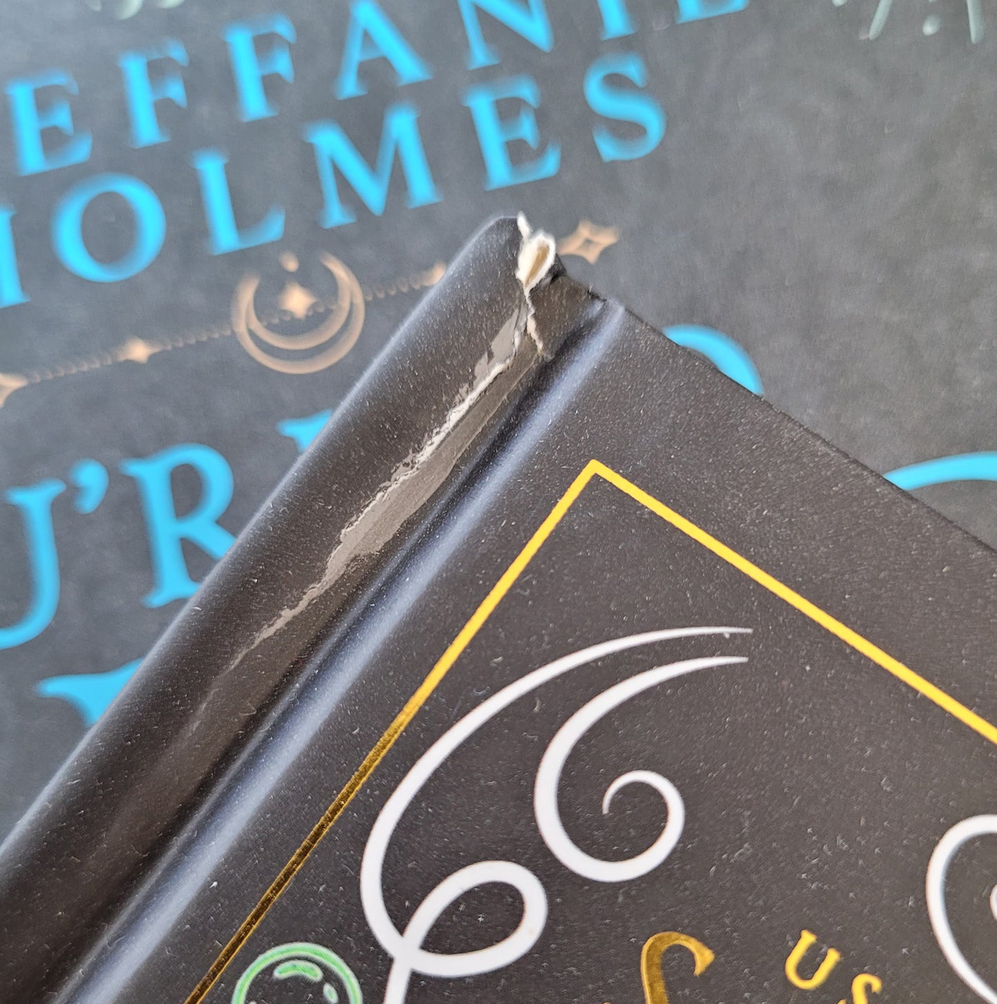 close up of a seconds hardcover book showing damage