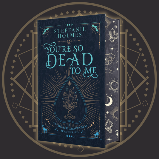 Signed hardcover edition of 'You're So Dead To Me' by Steffanie Holmes, featuring a black cover with gold and teal accents, and illustrations 